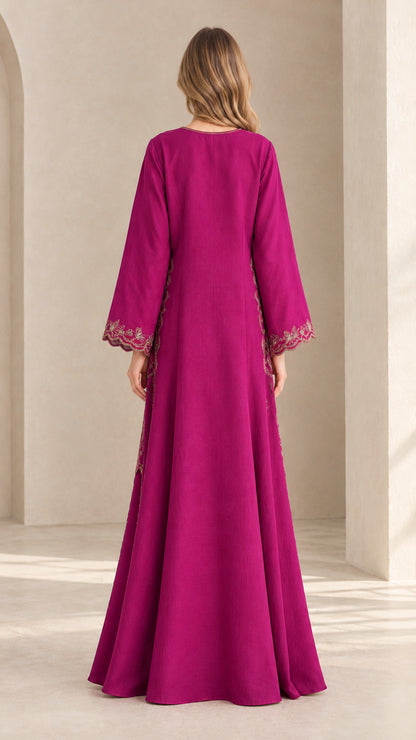 Full back view of model wearing magenta flared skirt set