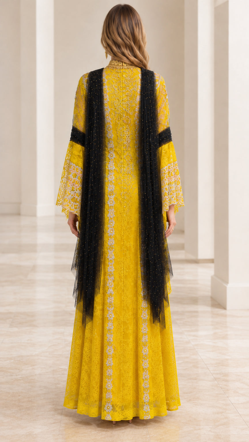 Yellow embroidered maxi gown back view showing flowing silhouette