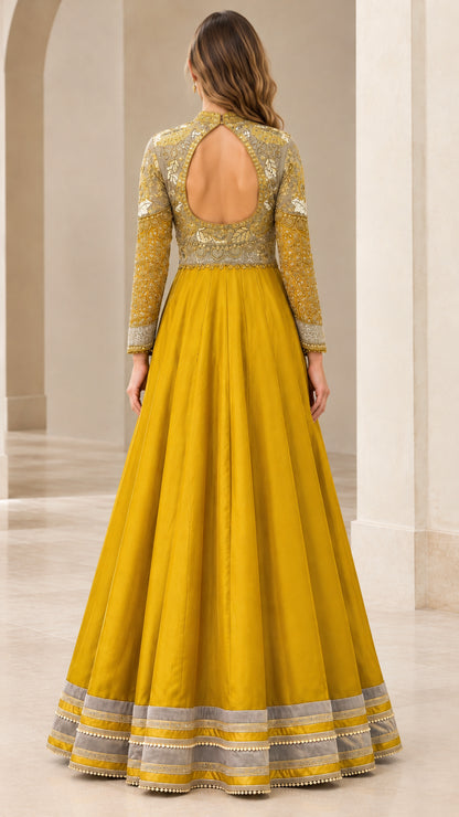 Back view showcasing keyhole cutout on Mustard Yellow embroidered gown