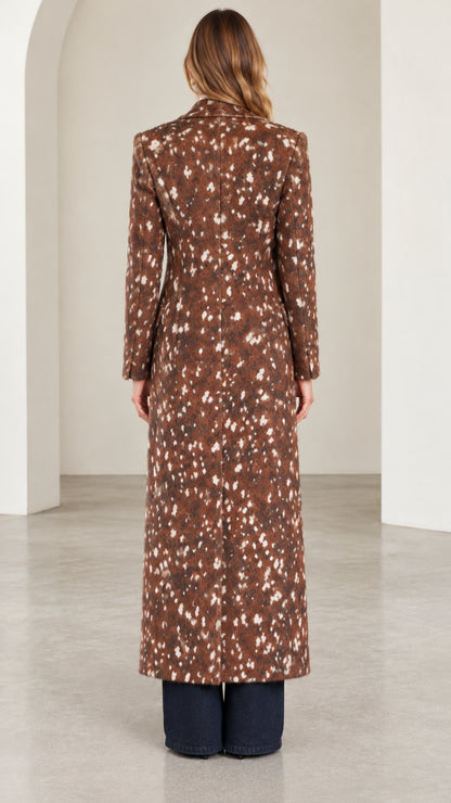 Back view of woman wearing brown speckled tailored maxi coat