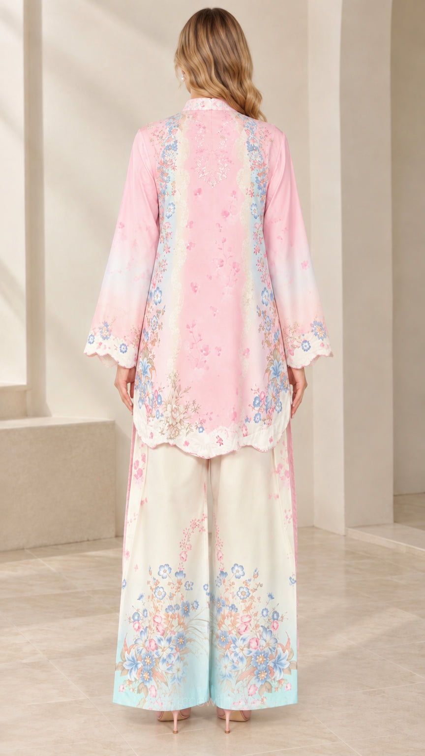 Back view of model wearing pink floral tunic set with wide leg trousers