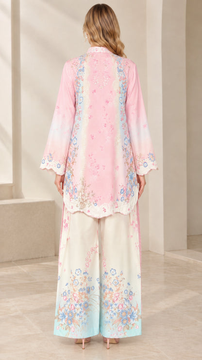 Back view of model wearing pink floral tunic set with wide leg trousers