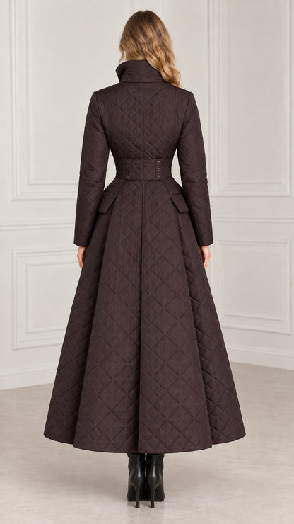 Back view of dark brown fit-and-flare quilted maxi coat showing waist tab detail