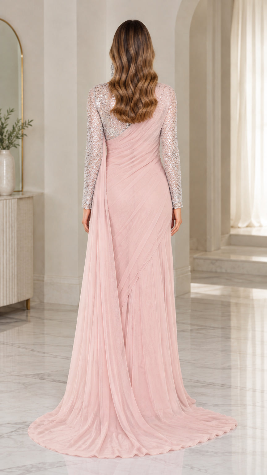 Back view of blush pink sequined evening gown showing flowing cascade train
