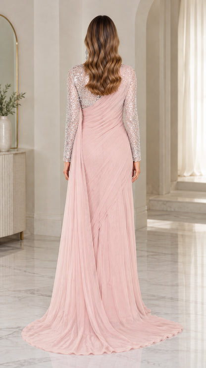 Back view of blush pink sequined evening gown showing flowing cascade train
