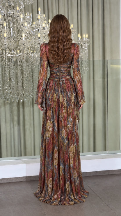 Back view of model wearing metallic plissé gown showcasing crisscross lace-up back