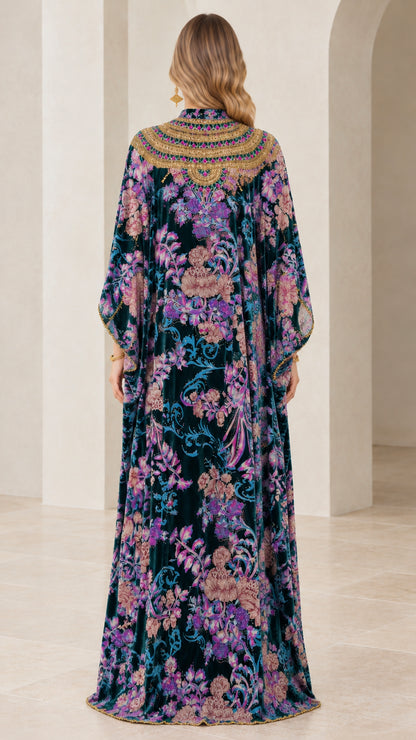 Back view of teal floral velvet maxi dress highlighting continuous print and drape