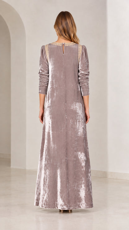 Back view of mauve crushed velvet maxi dress showing button detail at neck