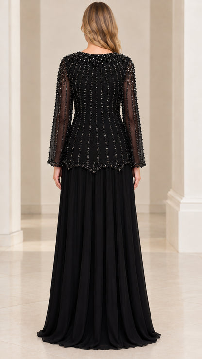 Back view of woman wearing Black beaded long sleeve evening gown