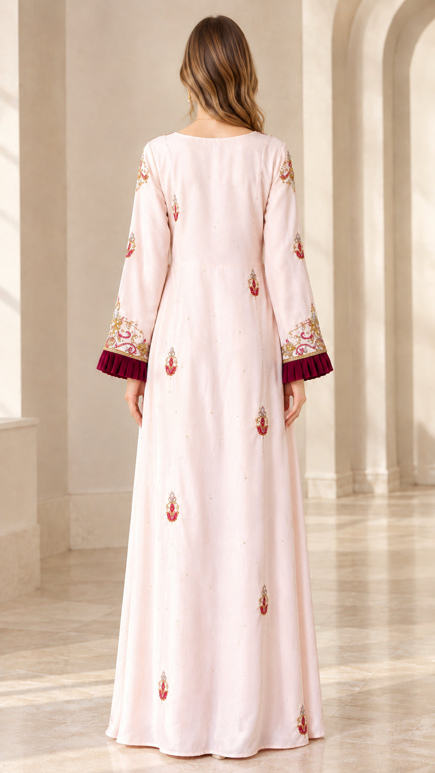 Back view of model wearing Blush Pink floor-length dress showing smooth drape