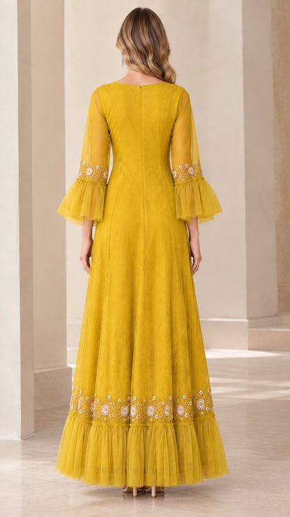 Back view of mustard yellow floor-length maxi dress with ruffle hem