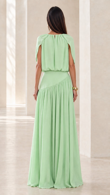 Back view of model wearing Mint Green floor-length cape dress