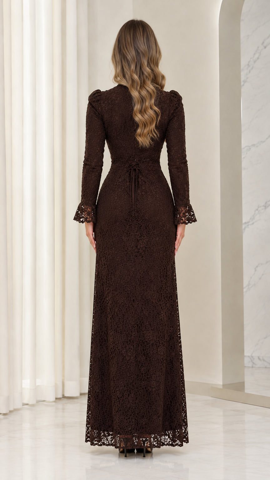 Back view of woman wearing chocolate brown lace maxi dress with waist tie
