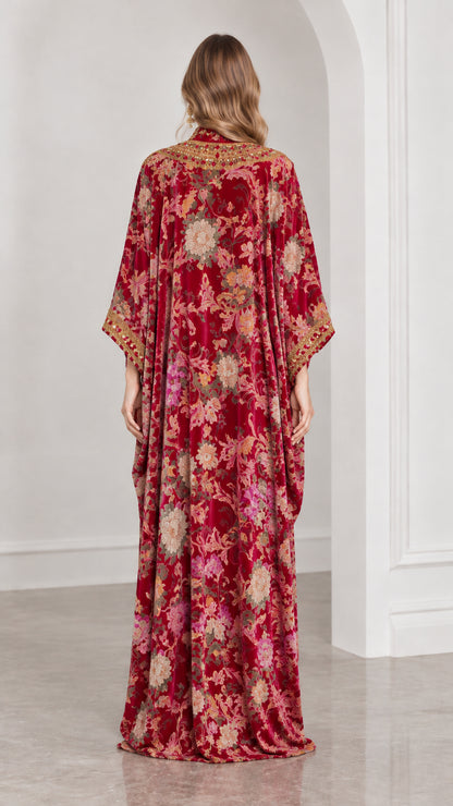 Back full-length view of burgundy floral velvet kaftan gown