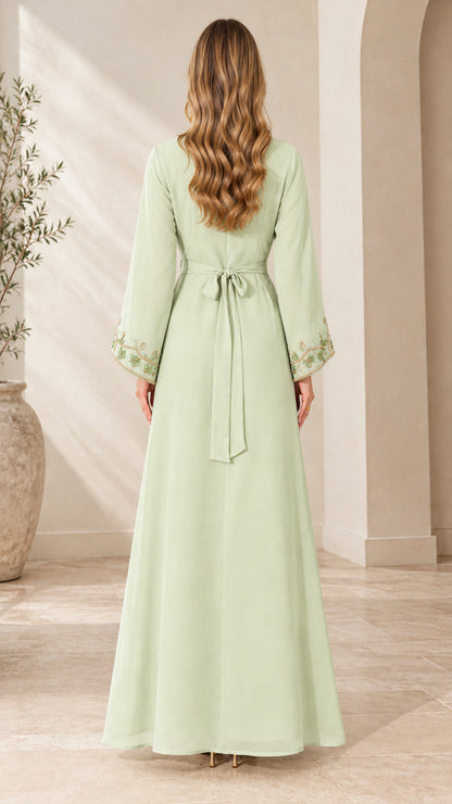 Back view of woman wearing Mint Green maxi dress showcasing waist tie belt