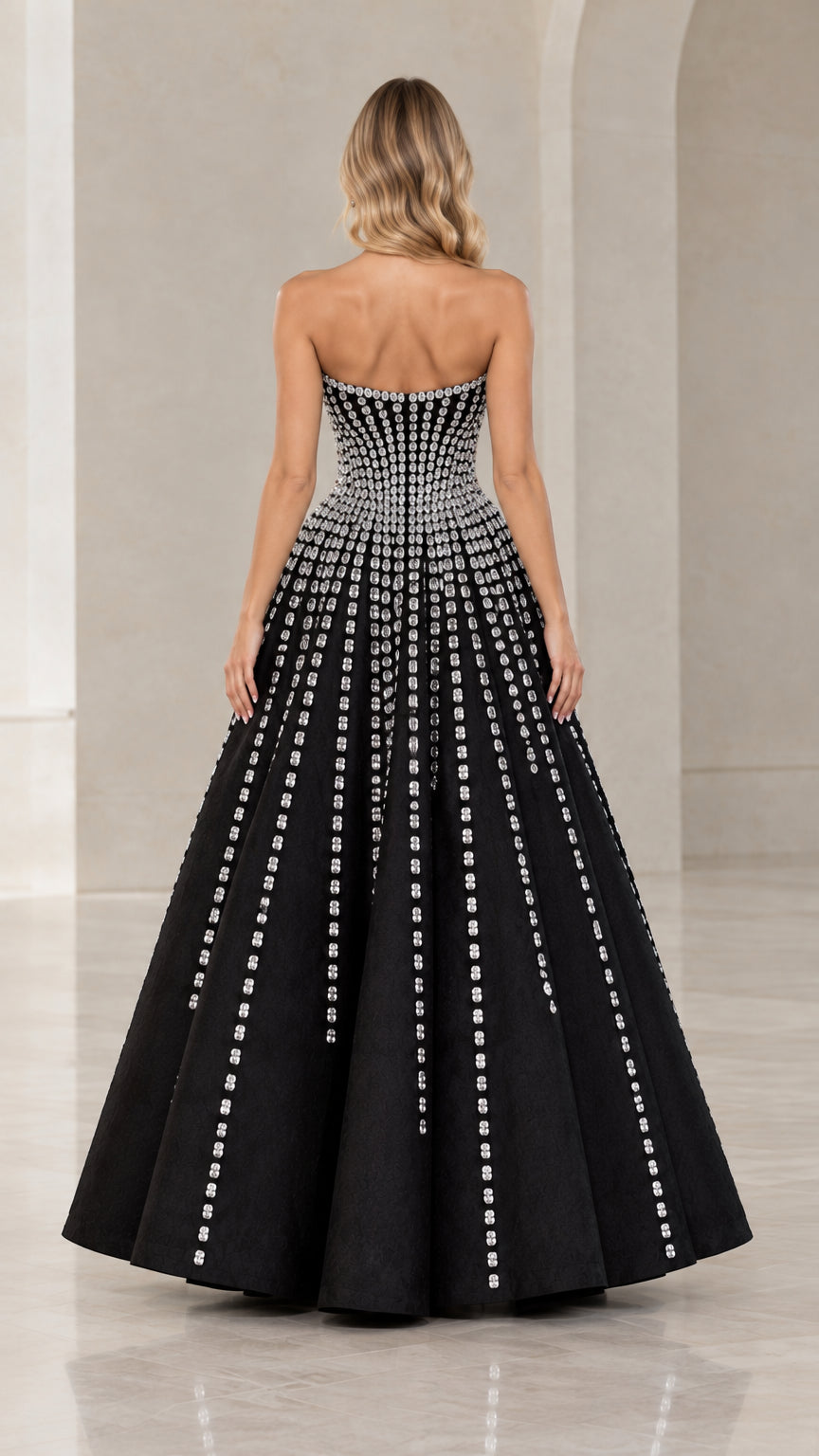 Back view of black strapless crystal embellished A-line evening dress