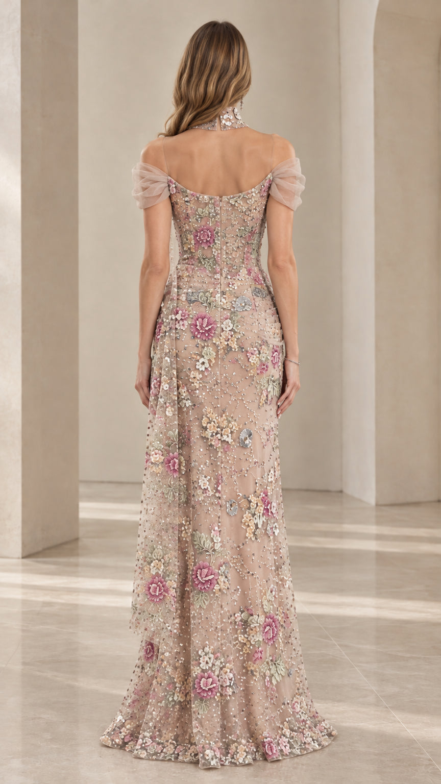 Back view of model wearing Champagne floral beaded formal dress with draped tulle sleeves
