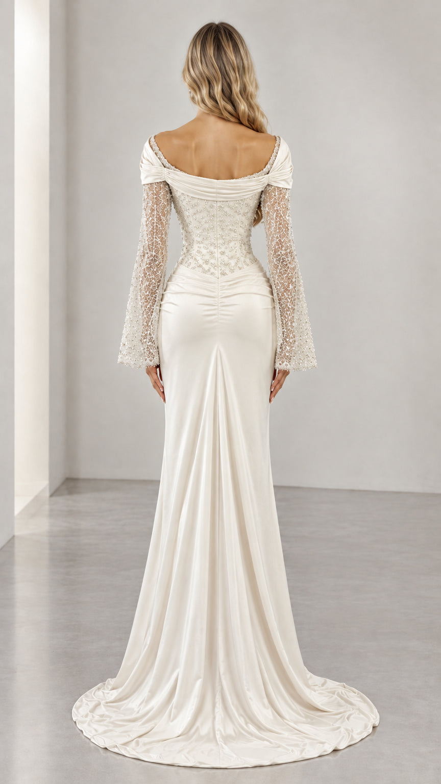Back view of ivory formal gown featuring low scoop back and puddle train