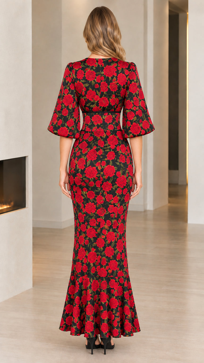 Back view of model wearing full-length black floral rose print dress