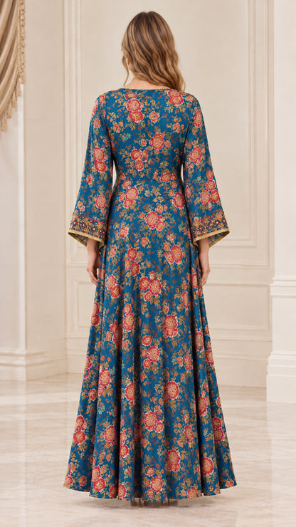 Back view of woman wearing peacock blue vintage floral maxi dress