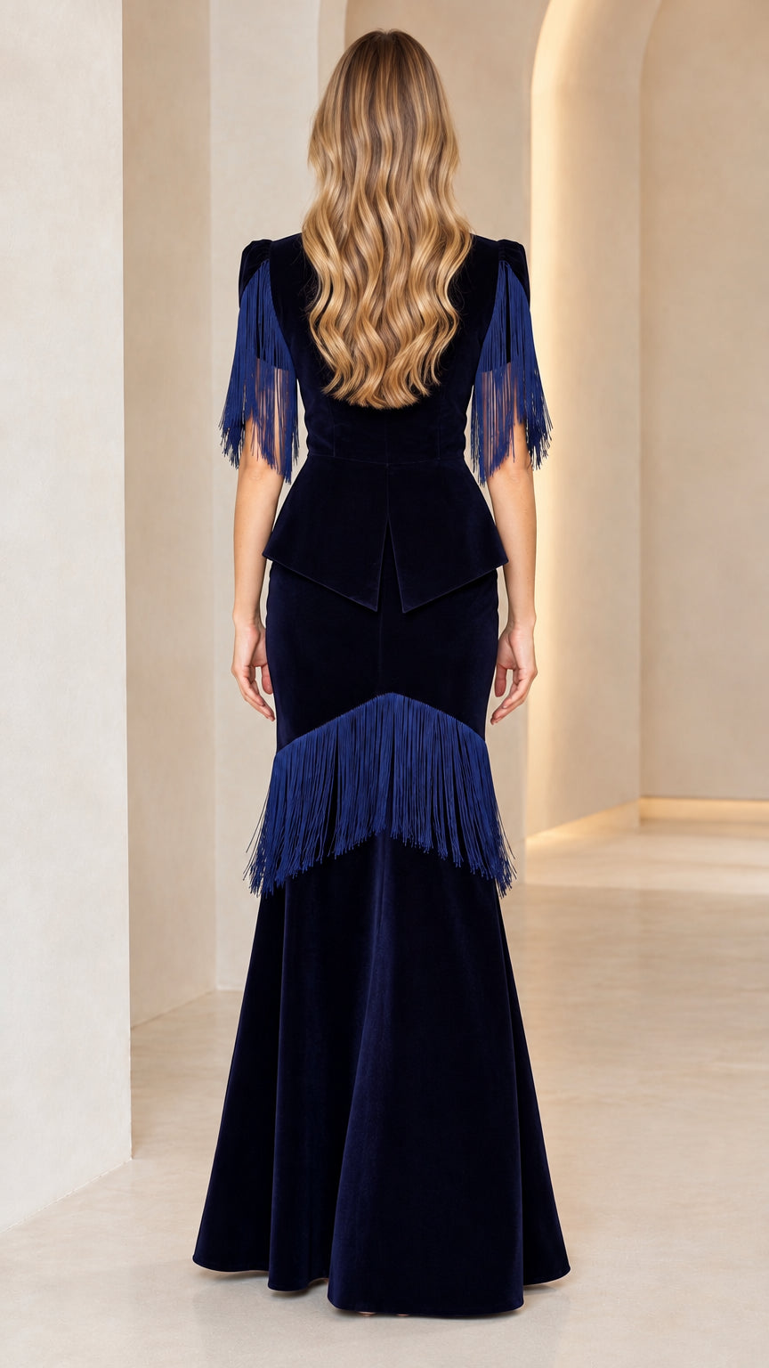 Back view of navy blue velvet evening gown showing concealed zip and peplum