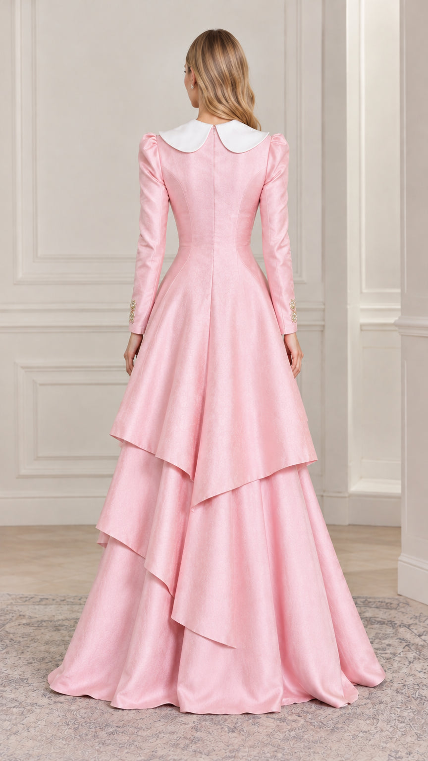 Back full-length view of woman showing cascading layered skirt on pink formal dress