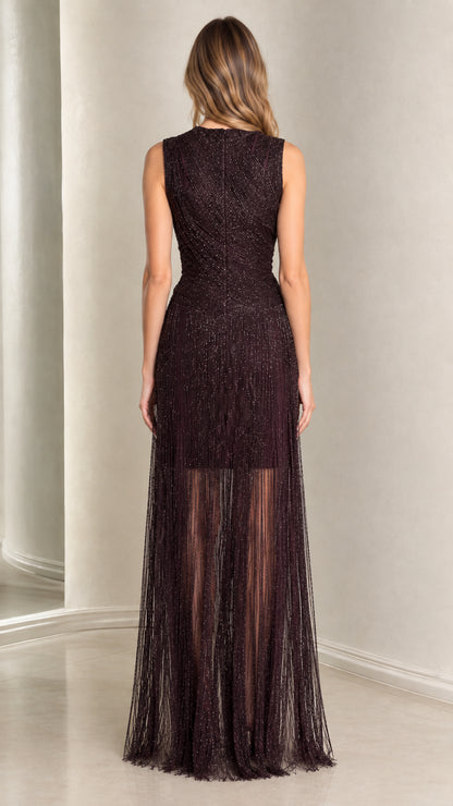 Back full-length view of woman in Deep Plum sleeveless beaded evening gown