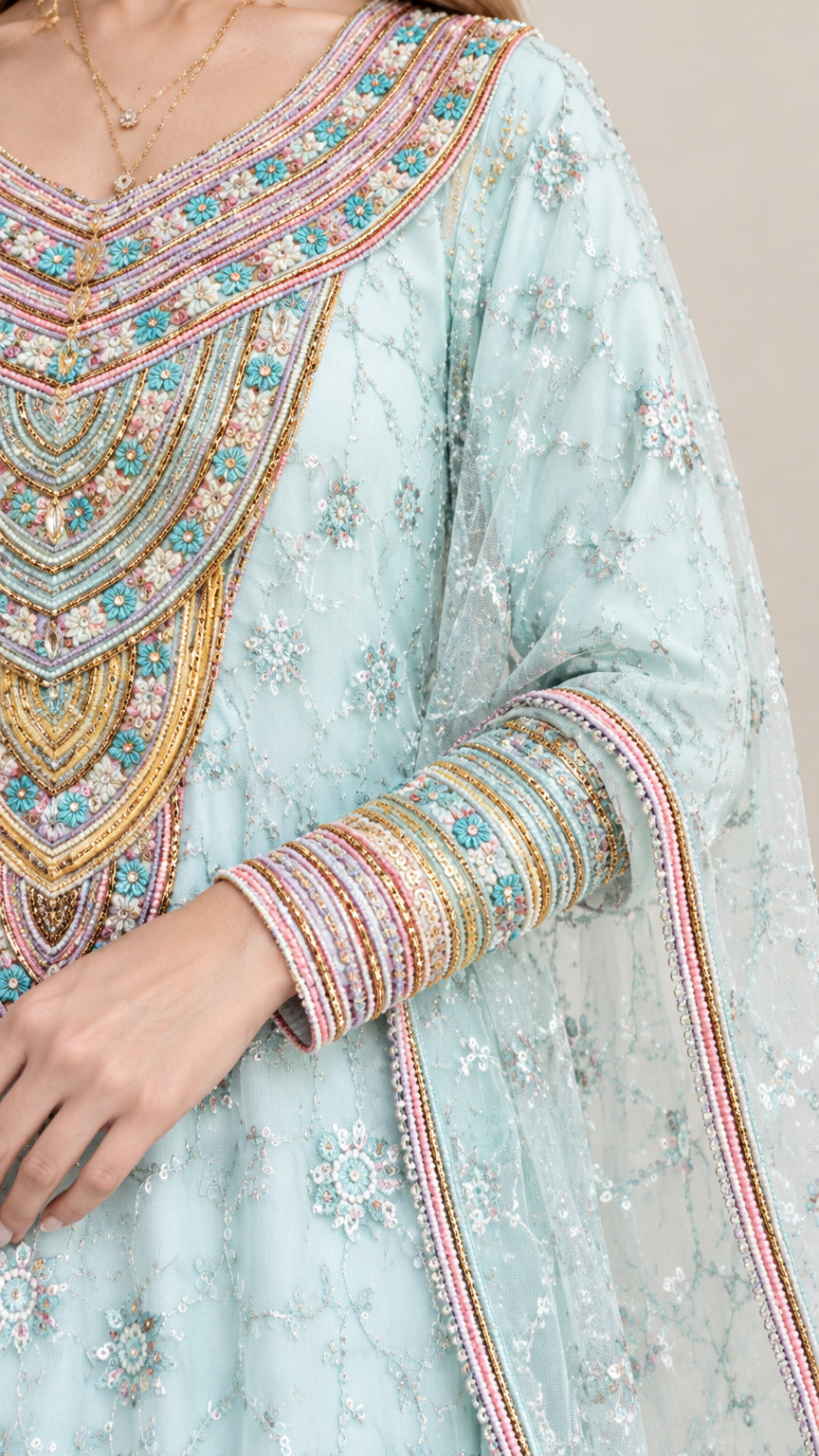 Close-up detail of ornate multi-colored beaded neckline and embroidered sleeve cuffs