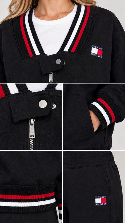 Close-up details of striped V-neck collar, snap tab zipper, and embroidered patch
