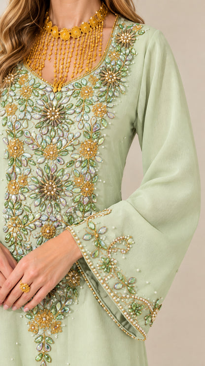 Close-up detail of intricate crystal and bead embroidery on bodice and neckline