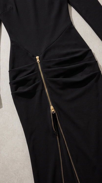 Close-up detail of gathered ruched waist and metallic exposed zipper