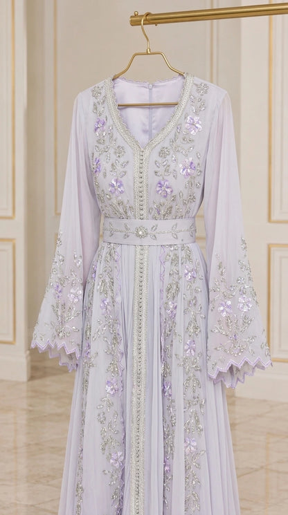 Hanger display of lilac embroidered chiffon kaftan dress showing beaded details