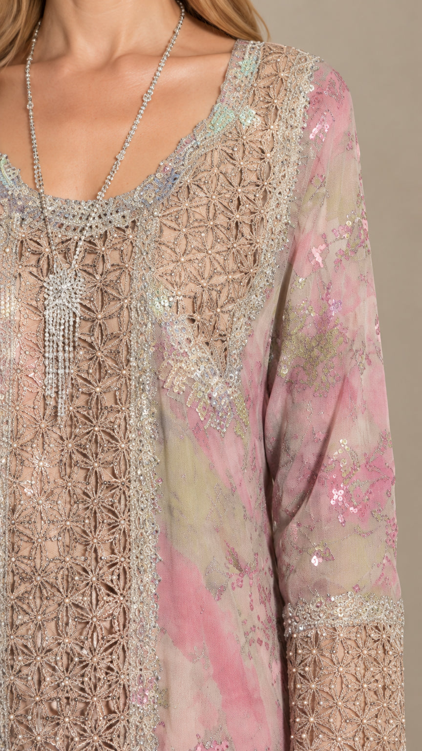 Close-up detail of ornate lace embroidery and sequins on dress bodice