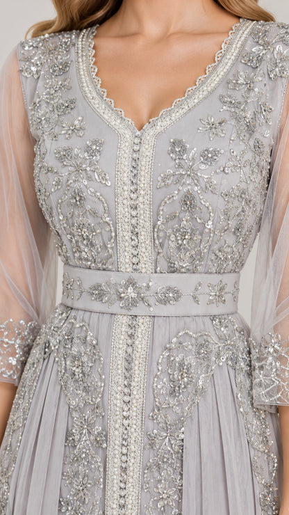 Close-up detail of silver grey V-neckline with intricate floral embroidery and beadwork