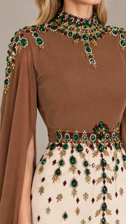 Close-up detail of ornate green crystal and gold bead embroidery on high neckline and waistband