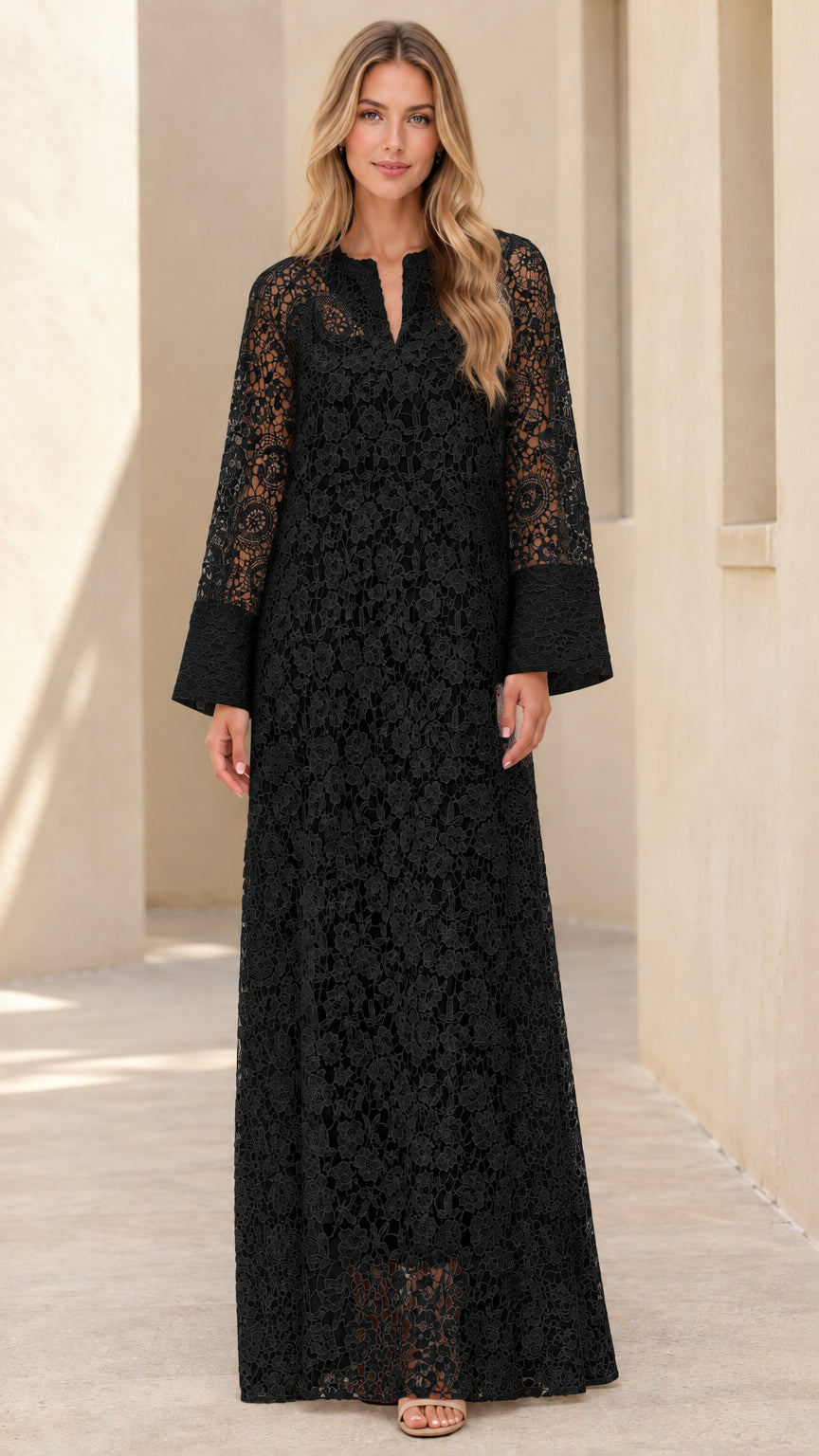 Woman wearing black floral lace long sleeve maxi dress