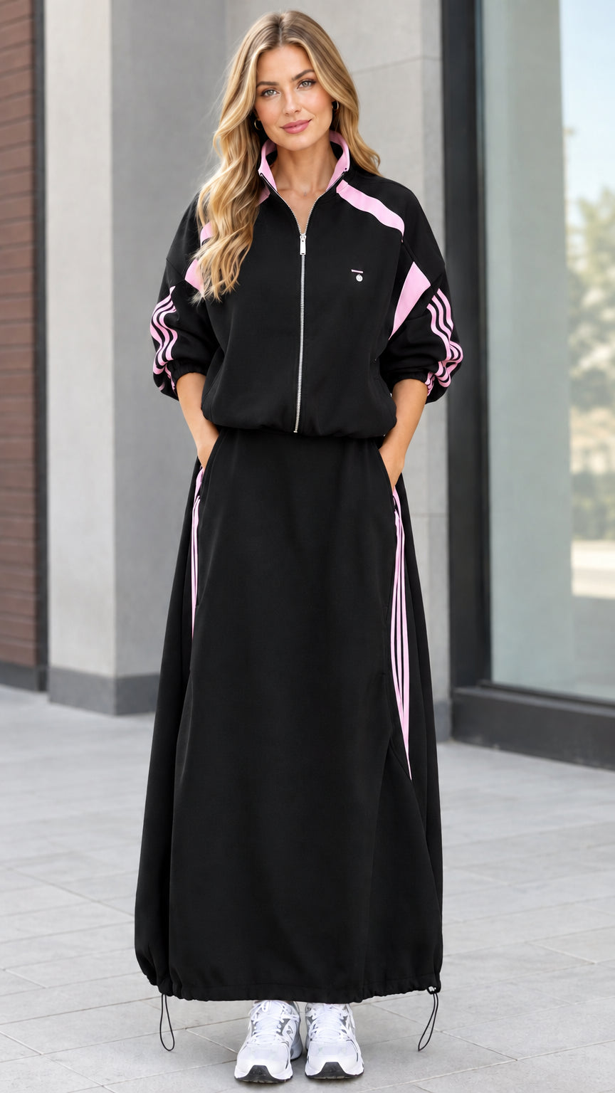 Black two-piece sporty zip jacket and maxi skirt set with pink side stripes