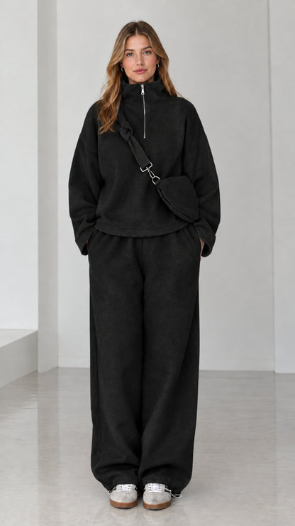 Black fleece half-zip sweatshirt and matching wide-leg track pants set