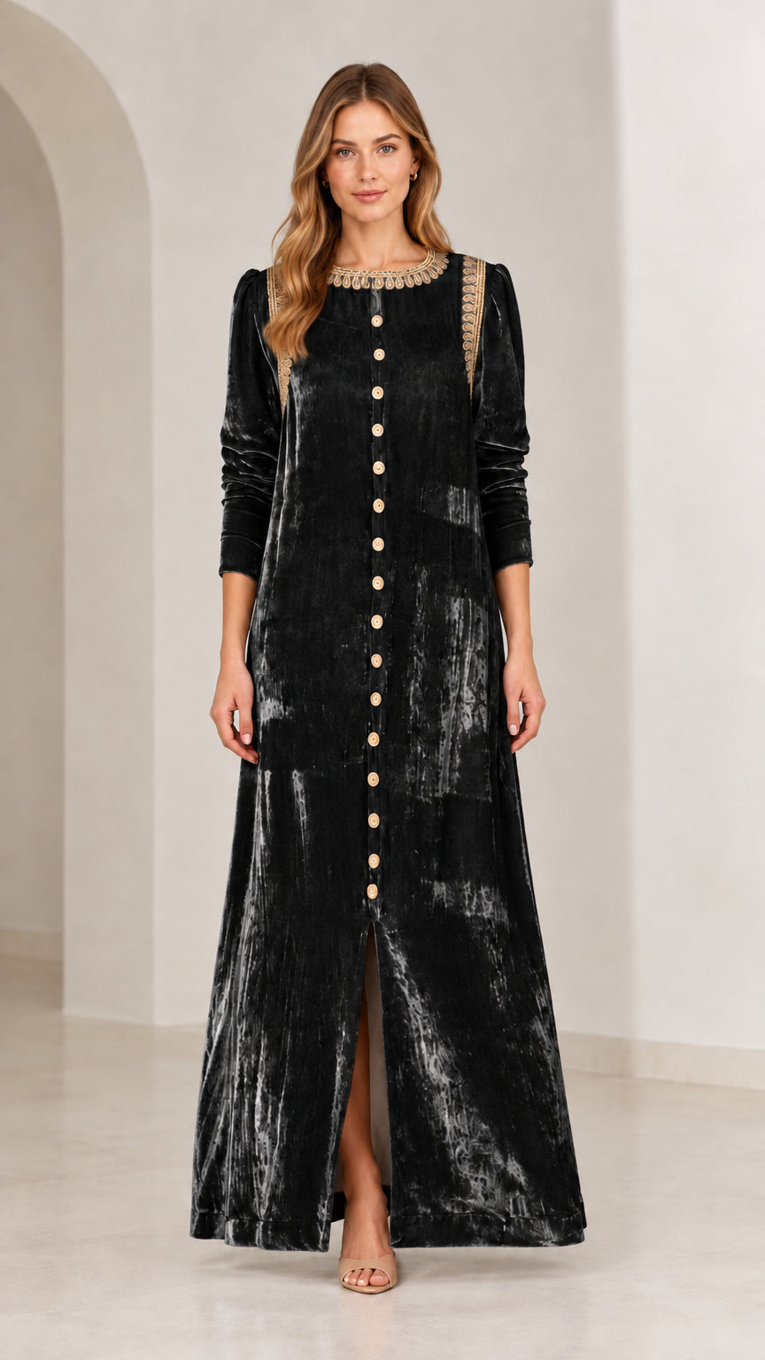 Full length front view of black crushed velvet maxi dress with gold trim