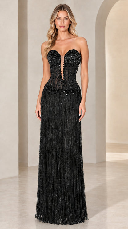 Front view of model wearing Black strapless beaded corset fringe evening gown