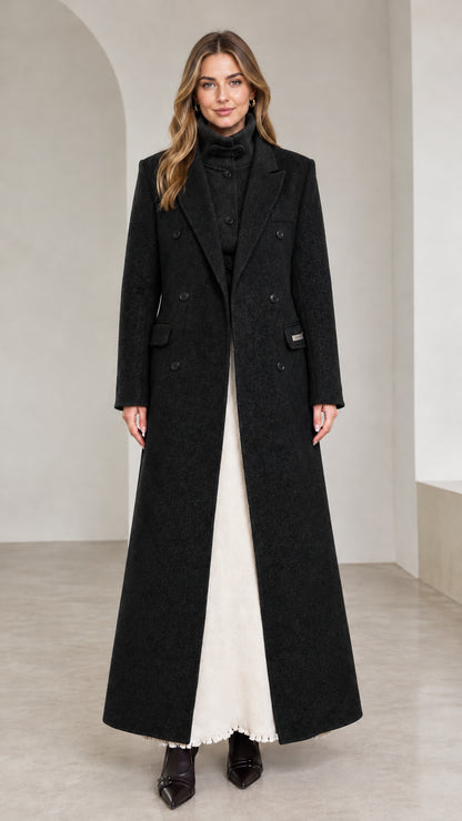 Front view of black double-breasted tailored floor-length overcoat