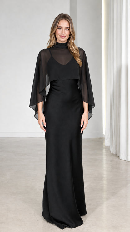 Front view of model wearing Black mock neck sheer capelet formal maxi gown
