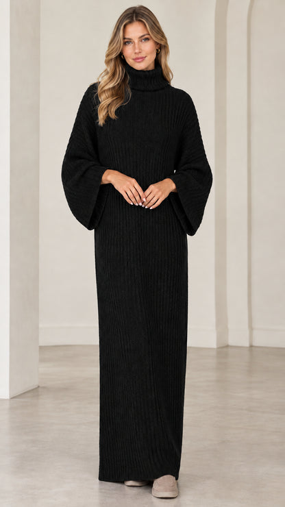 Full front view of model wearing black turtleneck ribbed maxi sweater dress
