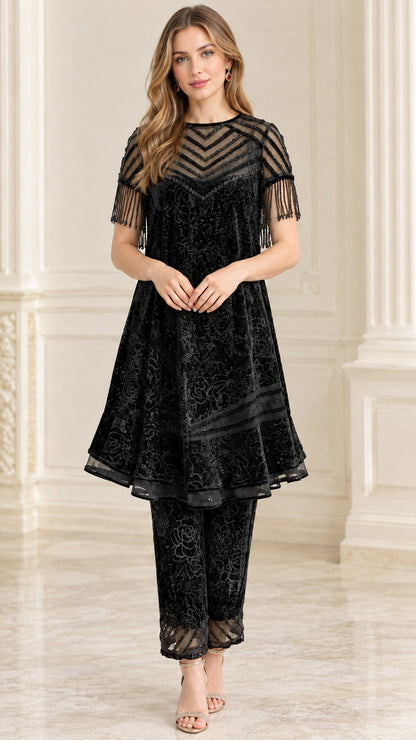 Black beaded sheer yoke velvet tunic and pants set on model