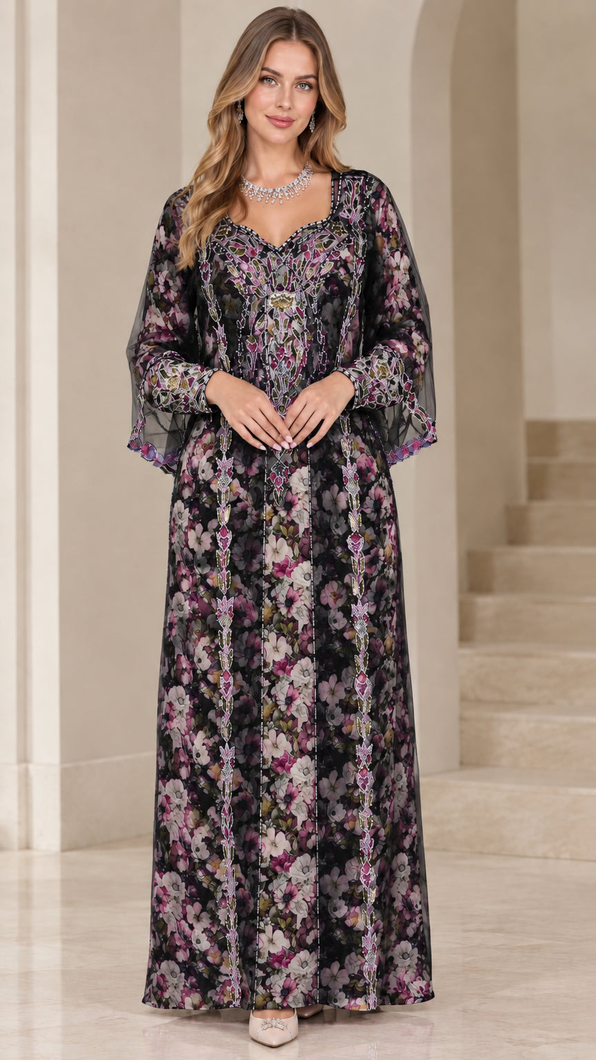 Front view of woman wearing black floral embroidered kaftan maxi dress