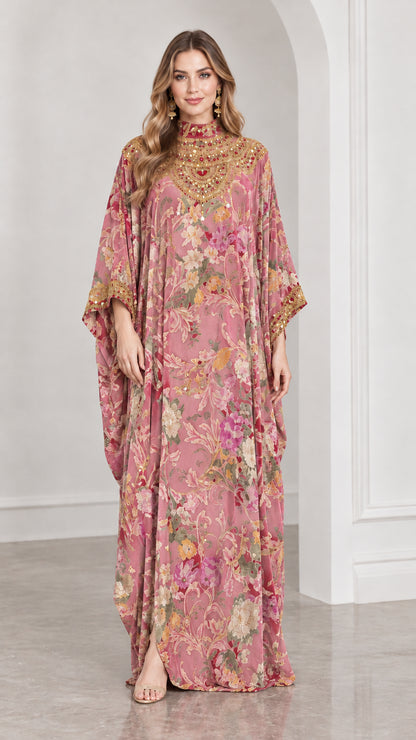 Front view of dusty pink floral velvet kaftan gown with embroidered high neck