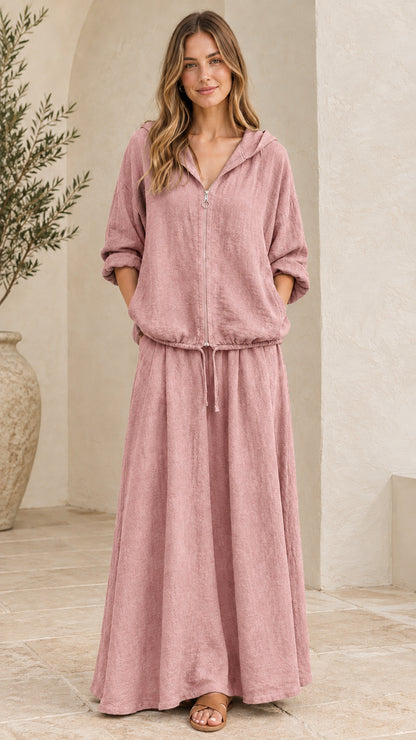 Front view of woman wearing dusty pink hooded top and matching maxi skirt set
