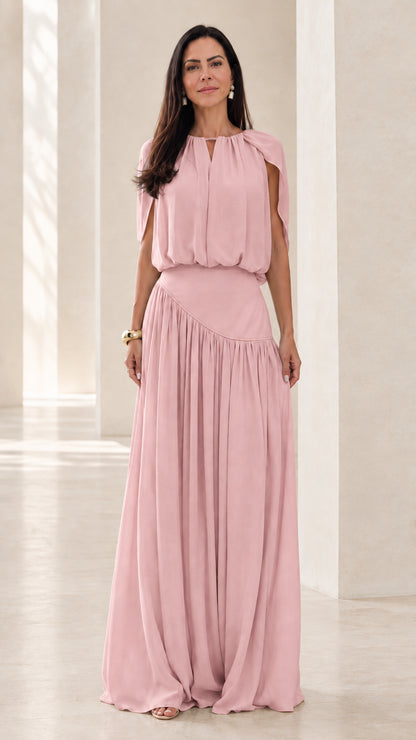 Front view of model wearing Blush Pink cape sleeve asymmetrical maxi dress