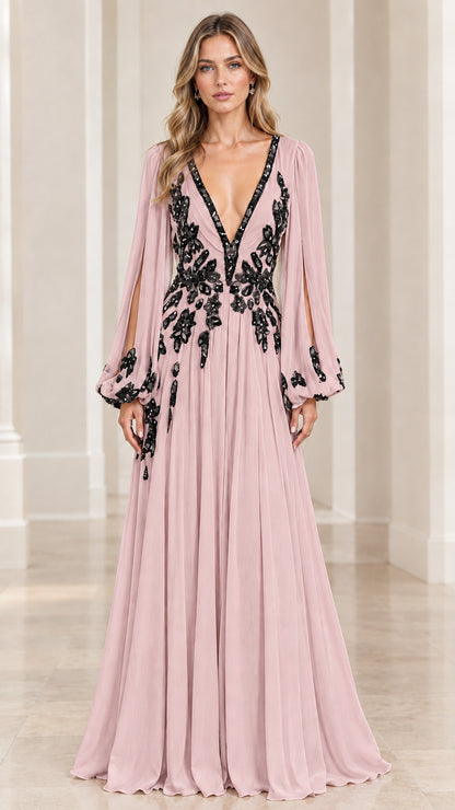 Model wearing blush pink floor-length evening dress with black floral embroidery