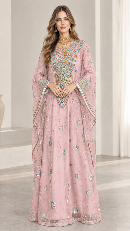 Front full-length view of woman wearing dusty pink embroidered kaftan maxi dress